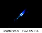 jet lighter with four blue flame with black backgound