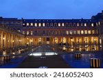 Small photo of Paris, France - January 19, 2024 : Panoramic view of Palais-Royal at rainy evening , originally called Palais-Cardinal, it was personal residence of Cardinal Richelieu in Paris.