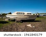 Dirty Salvaged Boat On Dry Land