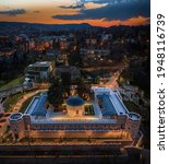 Budapest, Hungary - Aerial drone view of the illuminated Tomb of Gul Baba (Gul Baba Turbeje), a Turkish memorial monument and lookout on a spring night with colorful golden sky at background