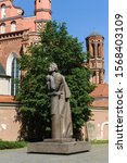 Small photo of Vilnius, Lithuania - May 20, 2017: Monument to Adam Mickiewicz against the background of the St Anne's and Bernadine's Churches
