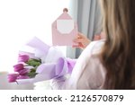 Woman Holding Envelope With...