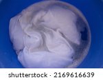 Small photo of White T - shirt soak in powder detergent water dissolution, washing cloth. Laundry concept