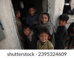 Small photo of Happy Afghan children smiling at the camera despite their difficult circumstances. Kabul Afghanistan Dec 1 2023