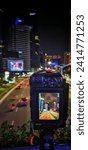 Small photo of Jakarta, Indonesia – November 8, 2023: A night cityscape view of Indonesia capital city Jakarta through the LCS of a camera
