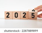Hand translated wooden cube from 2024 to 2024.new business goal strategy concept.2024 goal planning business concept.
