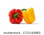 Fresh red and yellow bell peppers isolated on white background.