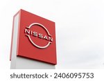 Small photo of Nissan motor company logo in front of dealership building, Nissan is a Japanese multinational automobile company. Guadalajara, Jalisco, Mexico, December 28, 2023.