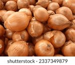 Small photo of Full frame shot of close up onions. Fresh and ripe onions. Onions background. Onions in market
