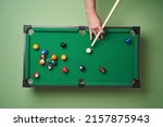 Billiard table with cue and balls. Snooker billiard game. Green billiard table as Leisure and entertainment concept