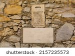 Small photo of A medieval denunciation box in Buzet, Croatia. The Italian text says it is for the anonymous reporting of people damaging woodland in the province. Commonly known as bocche di leoni (lion’s mouths)