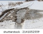 Snowy Road In A Field Leading...