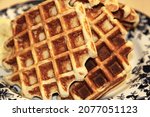 Homemade Belgium waffles served on a plate. Selective focus. High quality photo