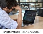 Small photo of Stressed business man crypto trader broker investor analyzing stock exchange market crypto trading decreasing chart data fall down loss, desperate about losing money of crisis, recession, inflation.
