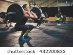 Fit young woman lifting...