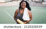 Small photo of Plus size african woman smiling at camera while doing running routine outdoor - Soft focus on face