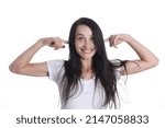 Small photo of Portrait of smiling woman puts fingers in ears. Positive emotions and extraneous noise concept