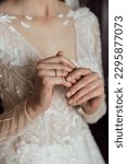 Small photo of Picture of man and woman with wedding ring.Young married couple holding hands, ceremony wedding day. Newly wed couple's hands with wedding rings.