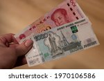 Chinese yuan and Russian ruble banknotes. Financial system of Russia and China. De-dollarization. World monetary system. China vs Russia.