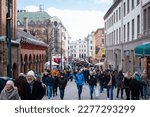 Small photo of Oslo, Norway - March 11, 2023: Karl Johans gate is the main street of Oslo with many shops, cafes and attractions. Popular walking street from Oslo Central station to Royal Palace.
