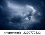 Small photo of Fine art: landscape photo of dark clouds, threatening a thunderstorm, blue tint