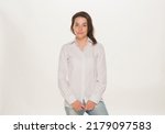 Small photo of portrait of a girl in a white shirt isolated.close-up portrait of a young girl in a white shirt on a white background isolated.emotions joy happiness surprise calmness chagrin.win lose.