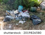 Small photo of terni,italy august 05 2021:illegal waste dumped by uncivilized people on the outskirts of the city