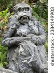 Small photo of Stone monkeys statues in sacred monkey forest. Old decorative monkey sculptures in Bali ubud sacred forest hindu temple, monkey forest