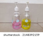 Small photo of bekasi, indonesia - april 2022 : the hand sanitizer bottle seen from the front. health protection background concept, hygiene, liquid soap, germicide,business,finance, medical,lifestyle,hand washing