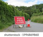 Country road ahead closed for traffic in Devon