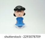 Small photo of Lucy van Pelt friend of Charlie Brown and Snoopy. Comic Peanuts. girl. Toy. Isolated white.