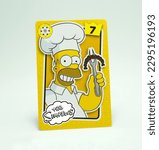 Small photo of The Simpsons. Homer Jay Simpson. Playing card with the image of the character from the animated series created by cartoonist Matt Groening. Cartoon. Husband of Marge and father of Bart, Lisa and Maggi