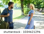 Small photo of Love at first sight concept. Man and woman likes each other. Casual encounter, meet on sunny summer day, nature background, defocused. Man with beard and blonde girl stopped to get acquainted.