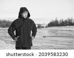 Pleasant thoughts. weather forecast. human and nature. man walking snowy landscape in sunset. travel and expedition concept. man in red parka. winter male fashion. warm clothes for cold climate