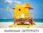 Small photo of yellow lifeguard at miami beach. lifeguard at miami beach in summer. lifeguard at miami beach vacation.
