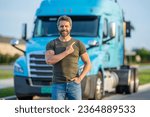 Small photo of hispanic man pointing finger on truck. Semi trucks vehicle. man driver near lorry. Man owner truck driver near truck. man driver near lorry truck. Semi vehicle. Trucking owner