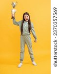 Small photo of being true champion. celebrating success. teen girl champion. sport success and victory. teen girl holding champion cup. girl winner in sport. successful sport and childhood of teen. Champion spirit
