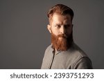 Small photo of handsome unshaven guy has beard and moustache, copy space. unshaven guy with beard and moustache