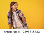 Young karaoke singer girl hold...