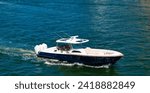 Small photo of Private boat off the beach. Summer vacation. Summertime yachting. Yacht vacation in summer. Boat trip. Travel and adventure. Motor private yacht in sea. Yacht in navigation. Motorboat cruise