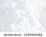 Small photo of Sky with clouds, a view from an aeroplane above the clouds. Abstract nature background with clouds in light tonality. White cumulus clouds