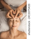 Small photo of massage therapist does facial , temporal lobe, relaxation, face-building