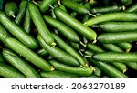 Small photo of Cucumbers top view, greenhouse cucumbers, long cucumbers, vegetables harvest, food background, place for text