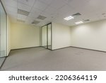 Small photo of Office space in bright colors with a glass door, unfurnished.