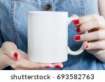girl is holding white cup  mug... | Shutterstock . vector #693582763