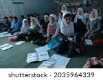 Afghan girls attend school in...