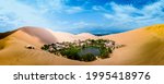 Oasis of Huacachina near Ica city in Peru. Lake and trees inside the dunes