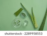 Small photo of Petri dishes with Aloe vera slices placed on arranged with a beaker filled with Aloe vera gel. Aloe vera (Aloe barbadensis miller) contains vitamins A, C, and E