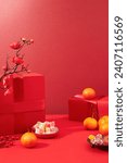 Small photo of Tangerines, a plate of colorful gummy candy, a plate of jam and a red gift box are displayed on a lucky red background. Space for display and advertising.