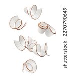 Small photo of Falling Coconut curls, shavings, isolated on white background, clipping path, full depth of field